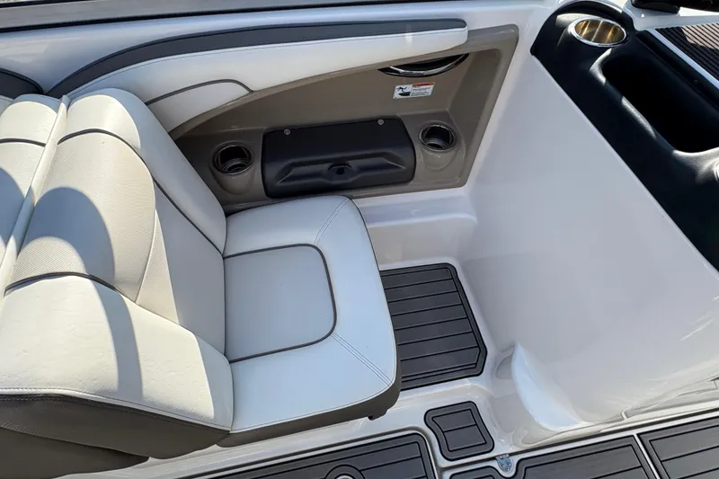 Slide: The Image of 2014 Yamaha Boats 242 Limited S interior seating with cup holders and sleek design. - 11