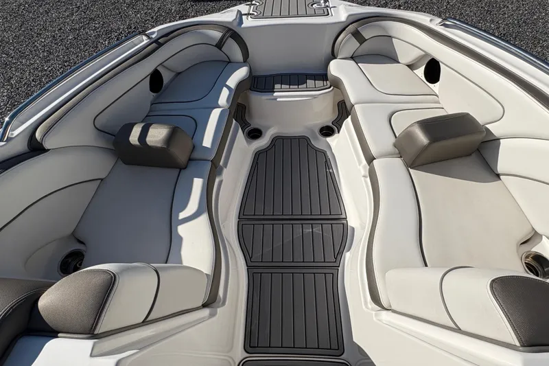 Slide: The Image of 2014 Yamaha Boats 242 Limited S interior with cushioned seating and sleek design. - 12