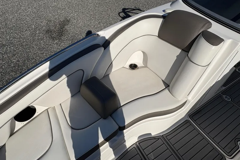 Slide: The Image of 2014 Yamaha Boats 242 Limited S interior seating with white and gray upholstery. - 13