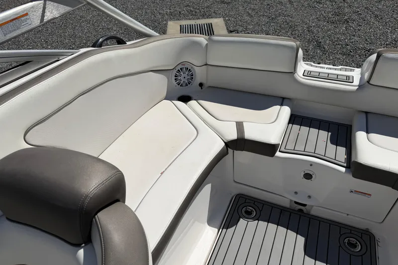 Slide: The Image of Interior seating of a 2014 Yamaha Boats 242 Limited S, featuring white and gray upholstery. - 19