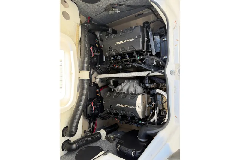 Slide: The Image of 2014 Yamaha Boats 242 Limited S engine compartment showcasing dual high-output engines. - 24