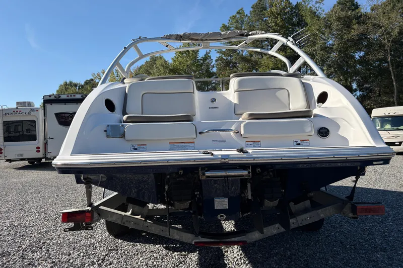 Slide: The Image of 2014 Yamaha Boats 242 Limited S on trailer, rear view, outdoors. - 3