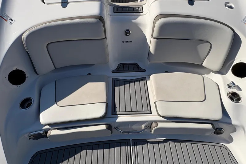 Slide: The Image of 2014 Yamaha Boats 242 Limited S interior seating with cushioned seats and sleek design. - 6