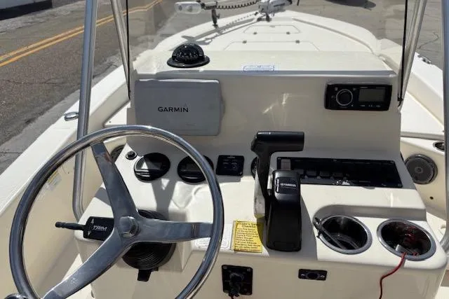 Slide: The Image of 2014 BlackJack 224 Bay boat console with Garmin GPS and steering wheel. - 6