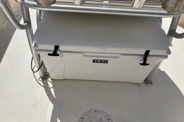 Slide: The Image of YETI cooler on 2014 BlackJack 224 Bay boat deck, secured with metal frame. - 7