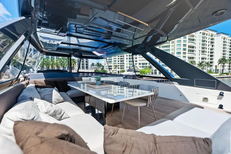 Slide: The Image of Luxurious 2018 Ferretti Yachts 850 Motoryacht interior with elegant seating and dining area. - 16