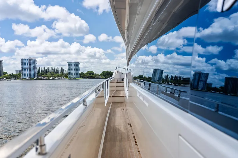 Slide: The Image of 2018 Ferretti Yachts 850 Motoryacht deck with cityscape and water reflection. - 32