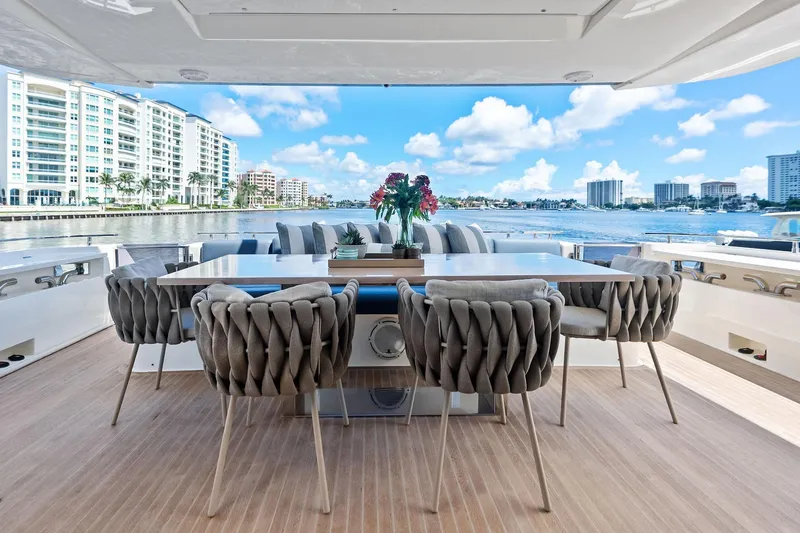 Slide: The Image of Luxurious 2018 Ferretti Yachts 850 Motoryacht deck with elegant seating and waterfront view. - 34