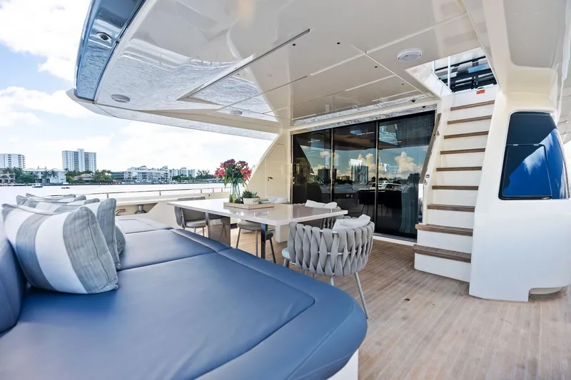 Slide: The Image of Luxurious 2018 Ferretti Yachts 850 Motoryacht deck with seating and dining area. - 36
