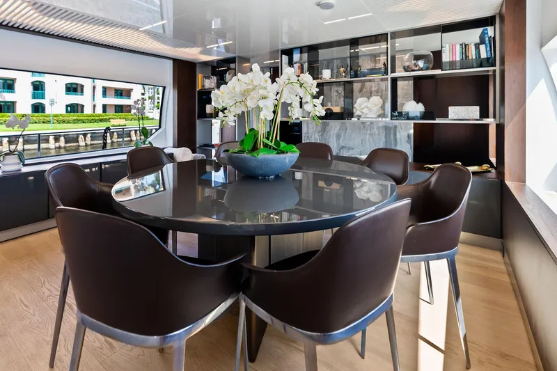 Slide: The Image of Luxurious dining area on 2018 Ferretti Yachts 850 Motoryacht with elegant decor and large windows. - 45