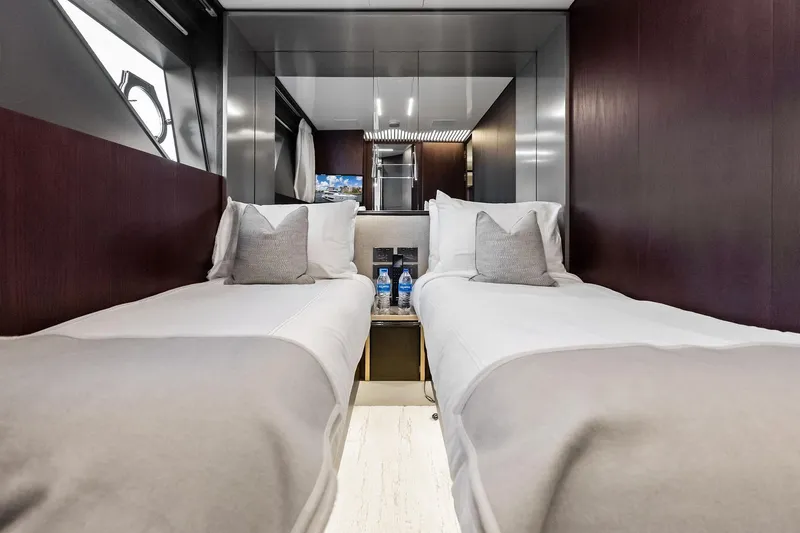 Slide: The Image of Luxurious twin cabin interior of 2018 Ferretti Yachts 850 Motoryacht, featuring elegant bedding. - 74