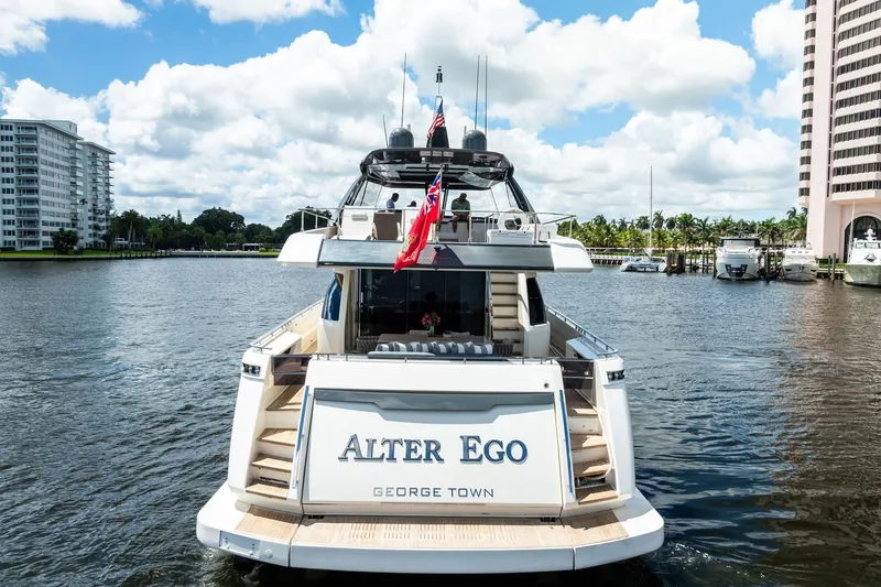 Slide: The Image of 2018 Ferretti Yachts 850 Motoryacht "Alter Ego" docked in a scenic marina. - 10