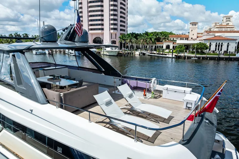 Slide: The Image of Luxurious 2018 Ferretti Yachts 850 Motoryacht docked by waterfront buildings. - 11