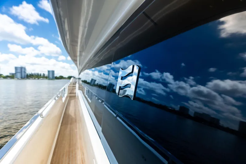 Slide: The Image of 2018 Ferretti Yachts 850 Motoryacht reflecting sky and water, sleek design. - 24