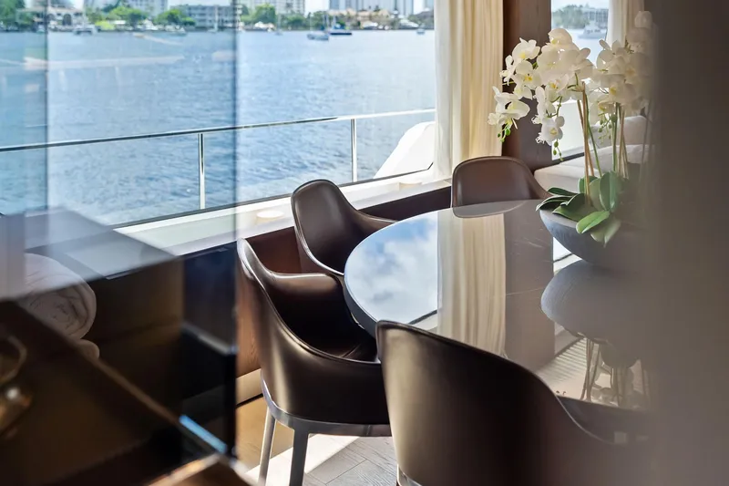 Slide: The Image of Luxurious interior of 2018 Ferretti Yachts 850 Motoryacht with elegant dining area and waterfront view. - 46