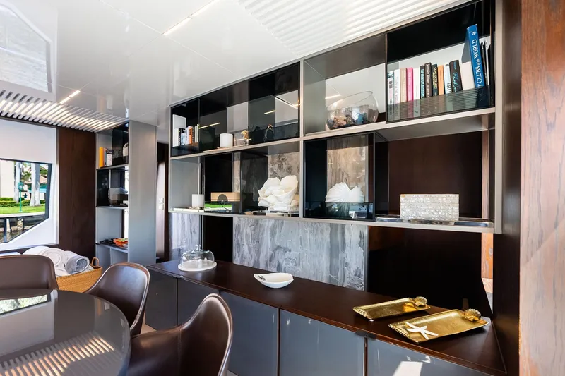 Slide: The Image of Luxurious interior of 2018 Ferretti Yachts 850 Motoryacht with elegant shelving and decor. - 47