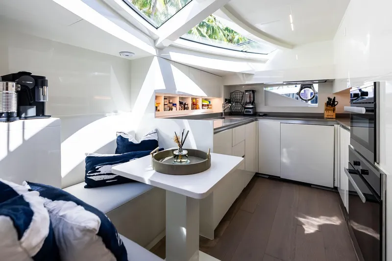 Slide: The Image of Luxurious kitchen interior of 2018 Ferretti Yachts 850 Motoryacht with modern appliances and seating. - 48