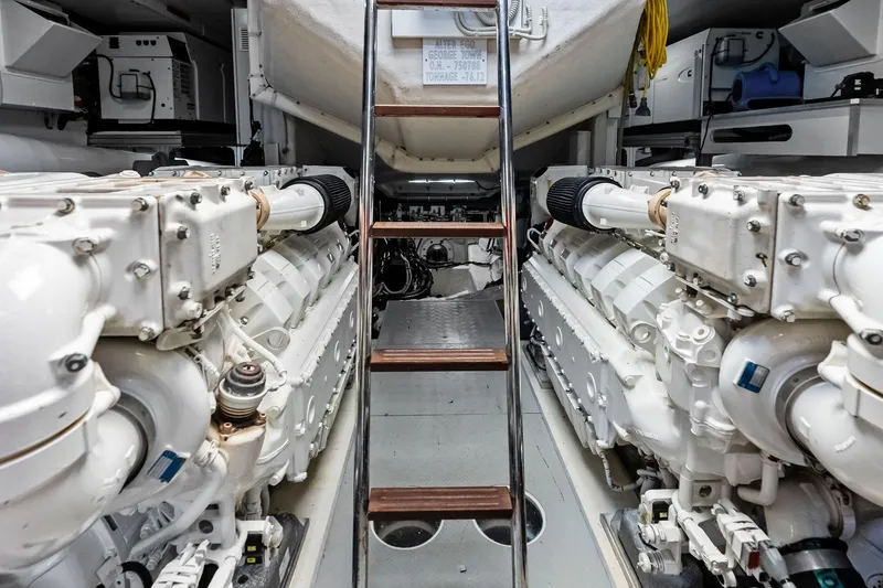 Slide: The Image of Engine room of 2018 Ferretti Yachts 850 Motoryacht with dual engines and ladder access. - 82
