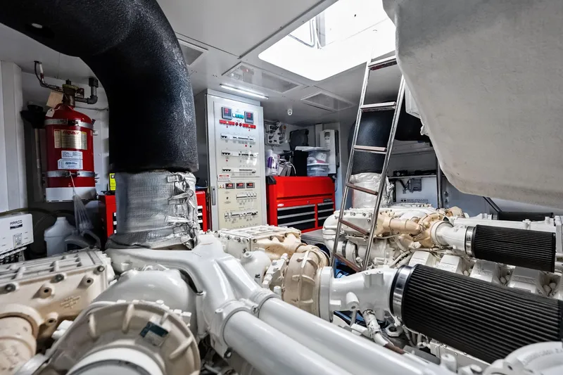 Slide: The Image of Engine room of 2018 Ferretti Yachts 850 Motoryacht with machinery and control panels. - 89
