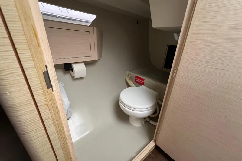 Slide: The Image of 2022 Saffier 33 Life yacht interior bathroom with toilet and wooden cabinetry. - 17