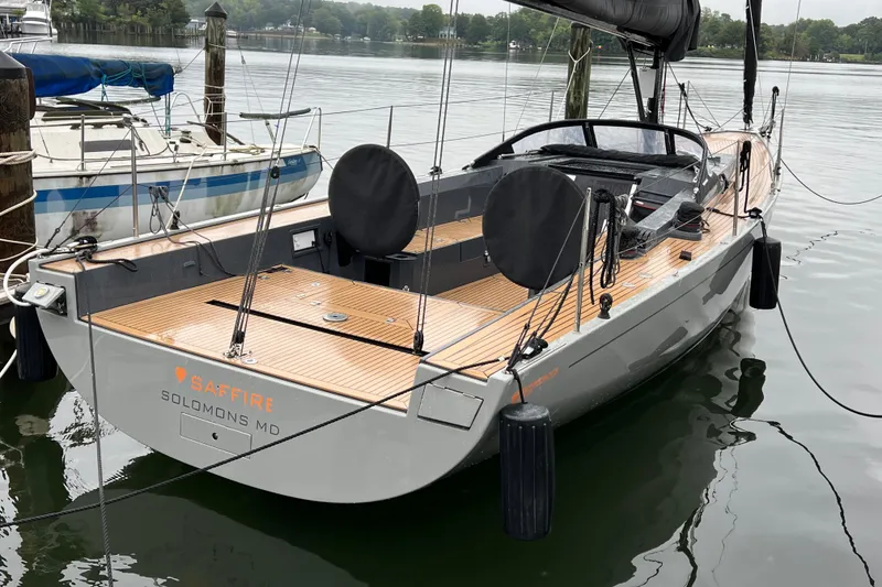 Slide: The Image of 2022 Saffier 33 Life sailboat docked, featuring sleek design and wooden deck. - 25