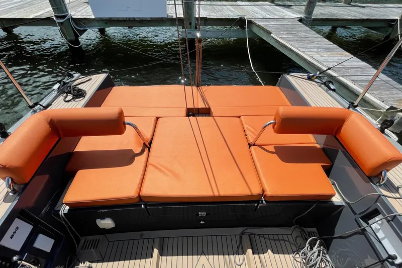 Slide: The Image of Luxury Saffier 33 Life yacht with orange cushioned seating, docked at marina, 2022 model. - 8