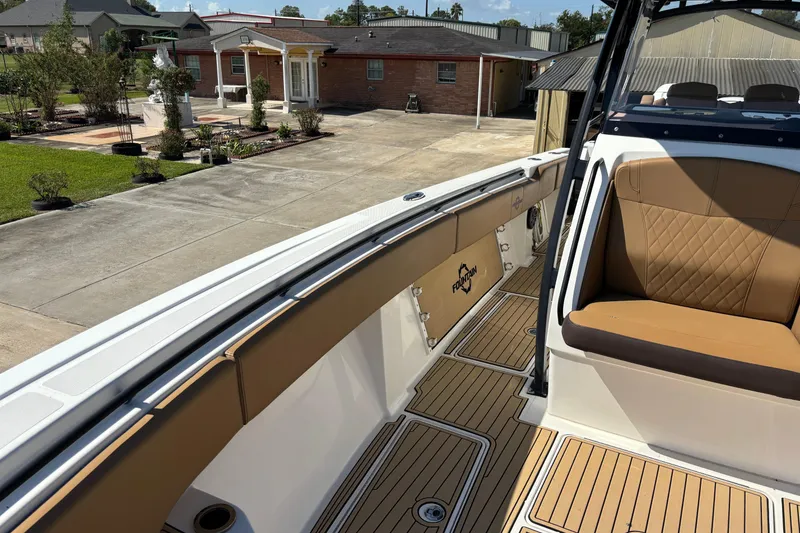 Slide: The Image of Blurry interior view of a 2019 Fountain 38 CC LS boat with open storage compartments. - 11