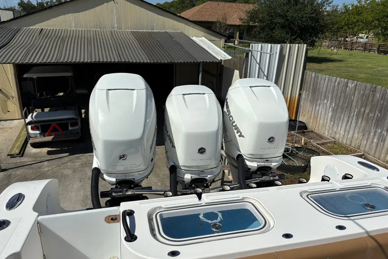 Slide: The Image of 2019 Fountain 38 CC LS boat on trailer, featuring sleek black and white design. - 15