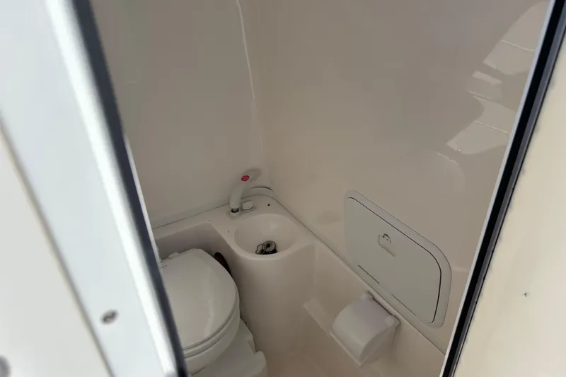 Slide: The Image of 2019 Fountain 38 CC LS boat dashboard with Garmin displays and Mercury steering wheel. - 13