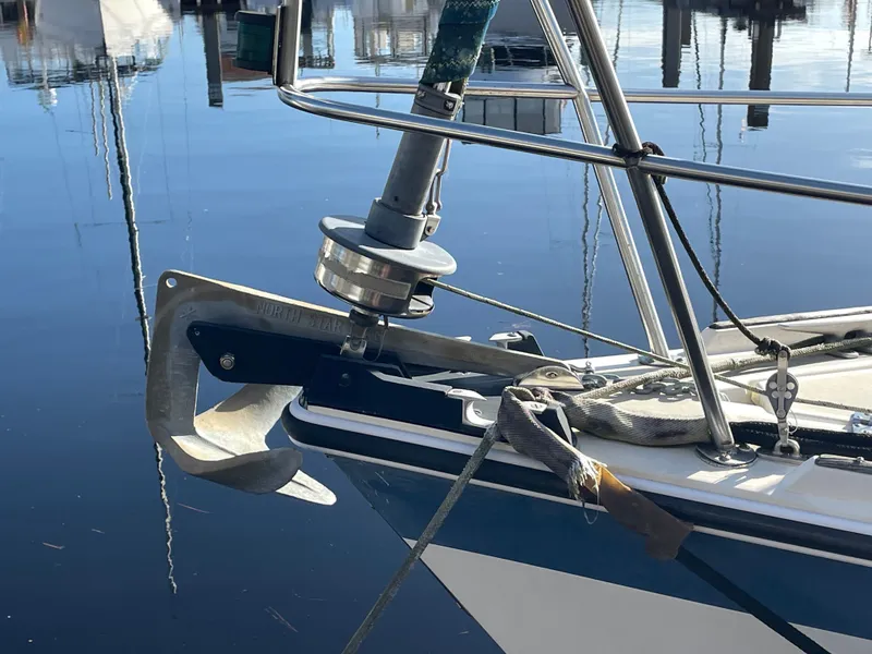Slide: The Image of Bow of 1982 O'Day 34 sailboat with anchor and calm water reflection. - 4
