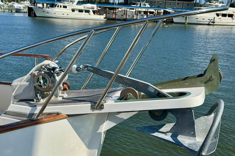 Slide: The Image of Cozy cabin interior of 1990 Grand Banks 36 Classic with wooden furniture and books. - 16