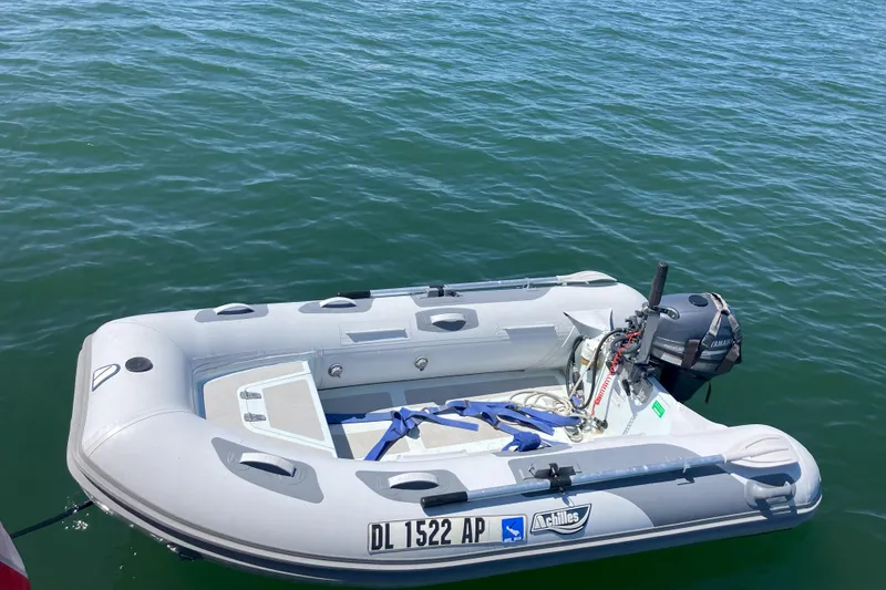 Slide: The Image of 1990 Grand Banks 36 Classic yacht with radar and blue canopy on a sunny day. - 28