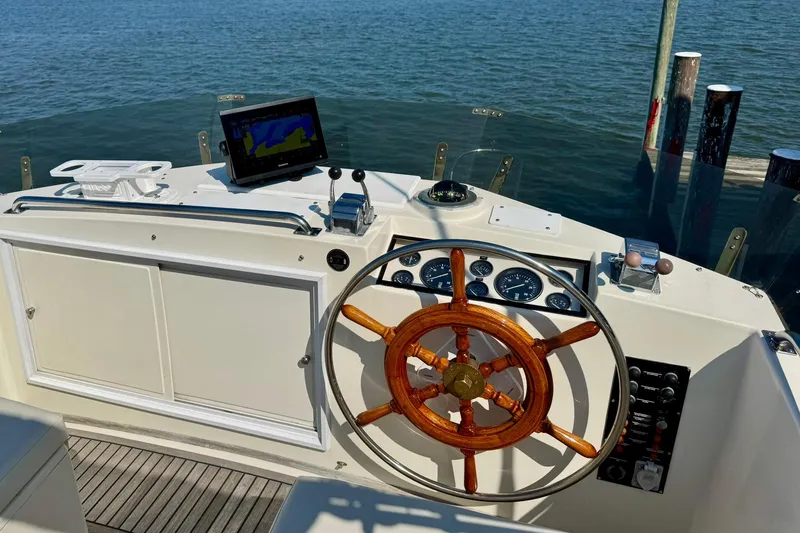 Slide: The Image of Inflatable boat with Yamaha motor on water, associated with 1990 Grand Banks 36 Classic. - 30