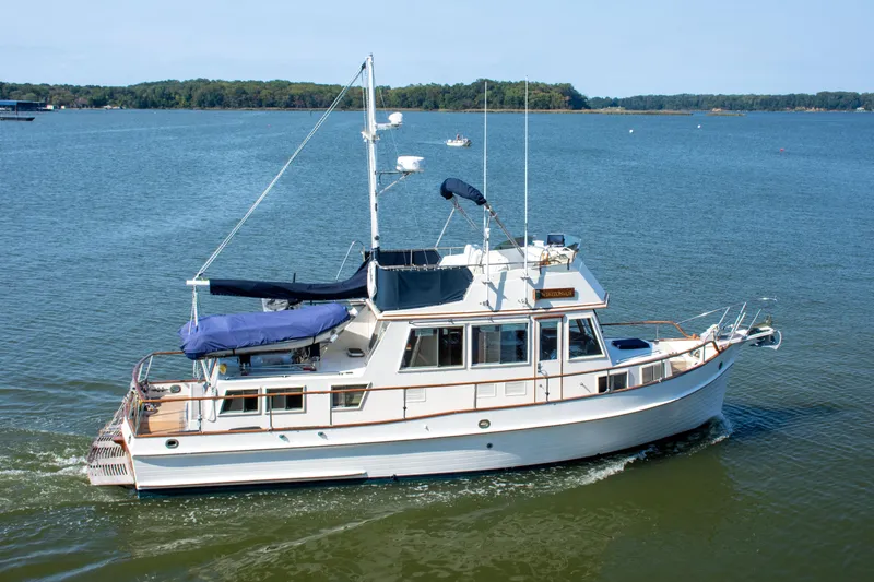 Slide: The Image of Interior of 1990 Grand Banks 36 Classic yacht with wooden furnishings and ocean view. - 5
