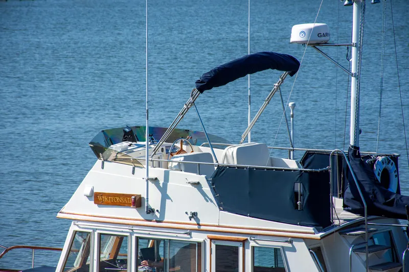 Slide: The Image of 1990 Grand Banks 36 Classic yacht kitchen with stove and wooden cabinetry. - 8