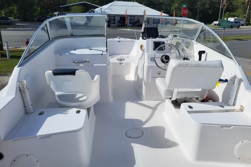 Slide: The Image of 2004 Pro-Line 20 DC boat interior with steering console and seating. - 6