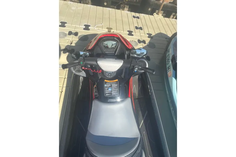 Slide: The Image of 2023 Kawasaki Jetski STX 160 on dock, showcasing handlebars and dashboard. - 5