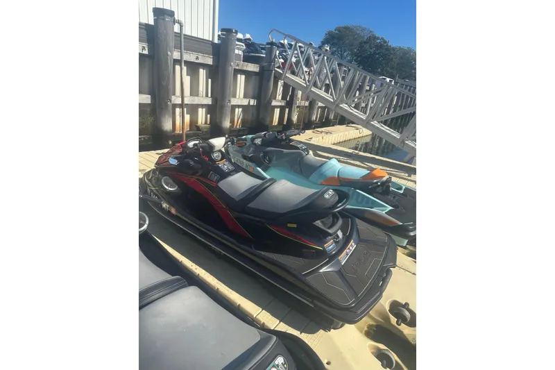 Slide: The Image of 2023 Kawasaki Jetski STX 160 docked, with vibrant design and sleek build. - 8