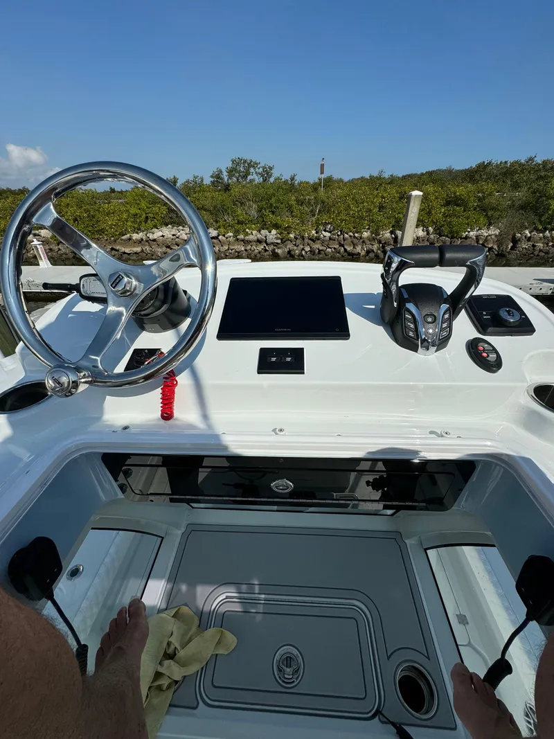 Slide: The Image of Freeman 28 boat dashboard, 2025 model, featuring steering wheel and control panel. - 19