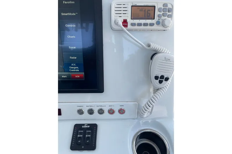 Slide: The Image of Control panel of 2015 Barker Boatworks 26 Bay with navigation and light switches. - 21