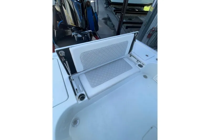 Slide: The Image of 2015 Barker Boatworks 26 Bay on forklift, showcasing rear deck and outboard motor. - 25