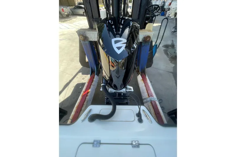 Slide: The Image of 2015 Barker Boatworks 26 Bay deck with storage compartments and measuring ruler. - 27