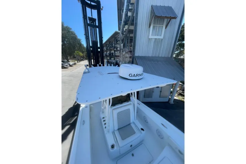 Slide: The Image of 2015 Barker Boatworks 26 Bay with Garmin equipment, docked in a marina setting. - 10