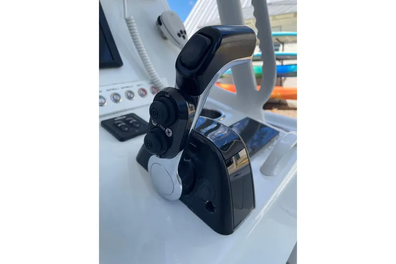 Slide: The Image of Dashboard of a 2015 Barker Boatworks 26 Bay with digital gauges and controls. - 18