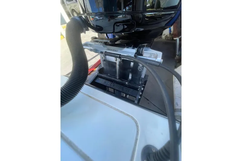 Slide: The Image of 2015 Barker Boatworks 26 Bay on forklift, rear view of motor and deck. - 28