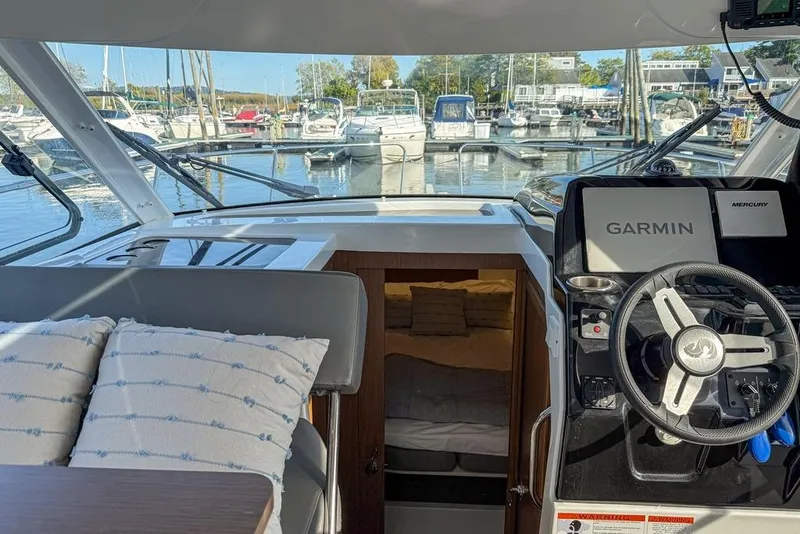 Slide: The Image of Interior view of 2024 Beneteau Antares 9 boat with Garmin navigation system. - 5