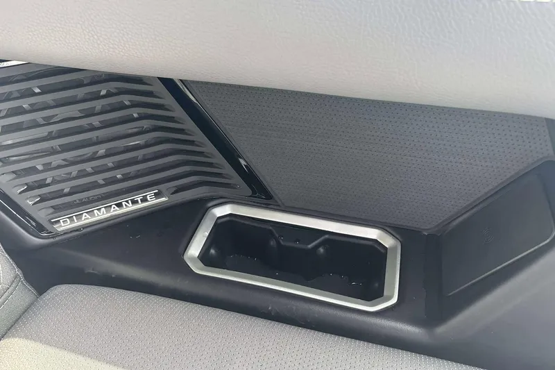 Slide: The Image of Interior detail of 2026 Viaggio D26U, featuring Diamante speaker grille and storage compartment. - 18