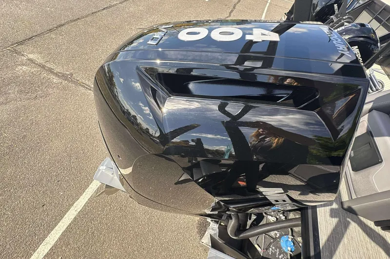 Slide: The Image of 2026 Viaggio D26U boat engine, glossy black finish, reflecting sky and surroundings. - 26