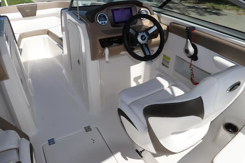 Slide: The Image of 2021 Chaparral 23 SSi OB boat interior with steering wheel and seating. - 26