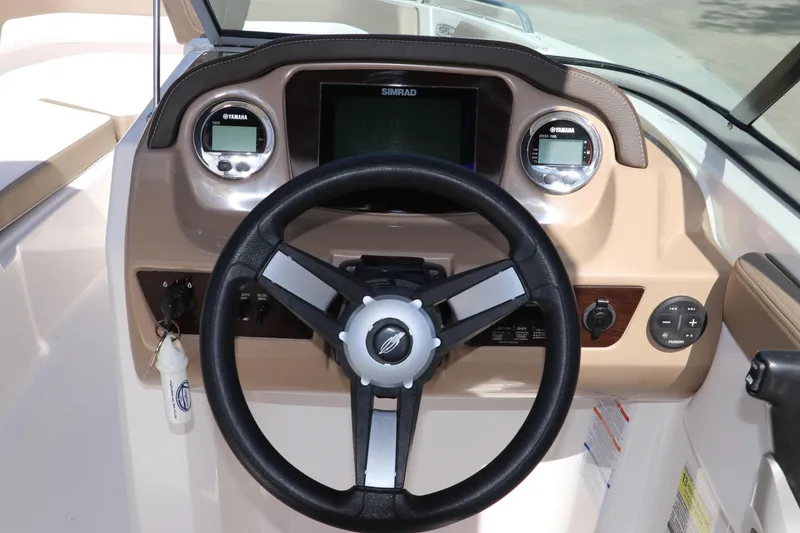 Slide: The Image of 2021 Chaparral 23 SSi OB boat dashboard with steering wheel and Yamaha gauges. - 29